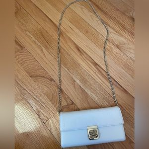 White crossbody bag with gold hardware